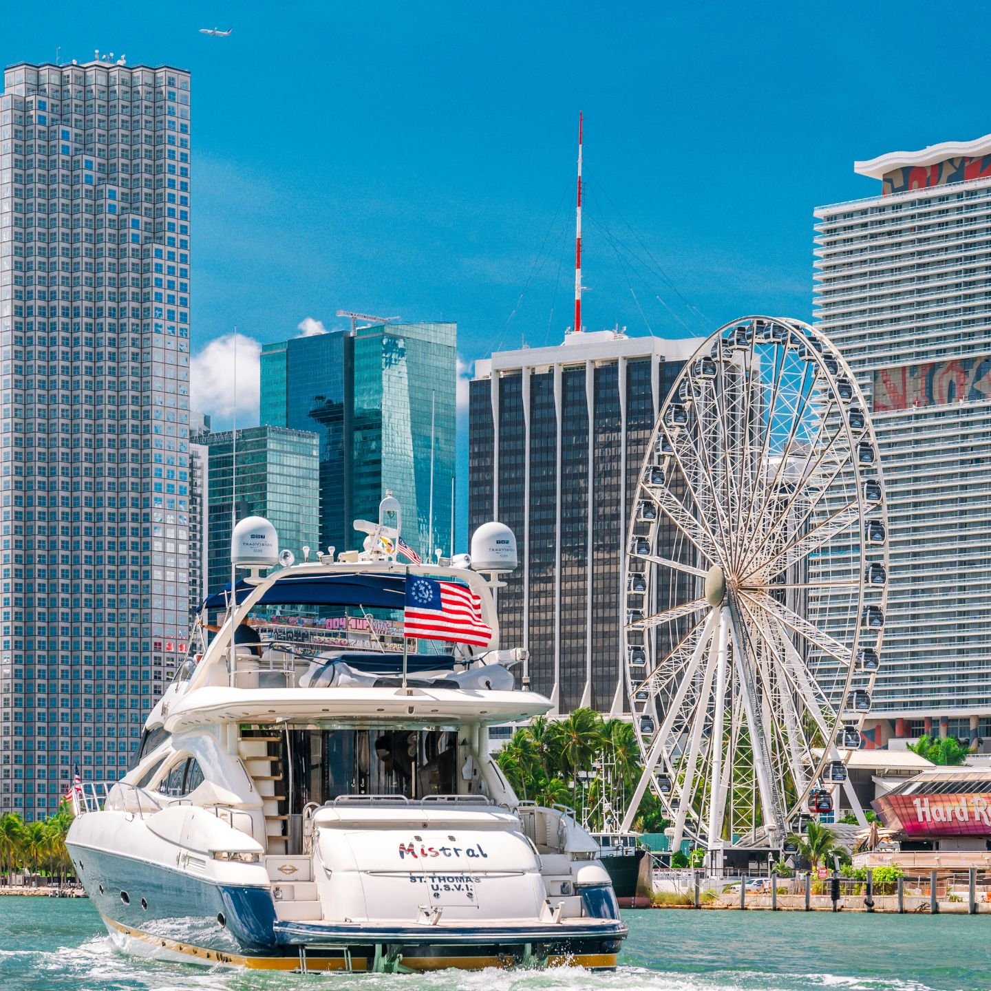 Yacht docked by the Bayside Ferris wheel in downtown Miami