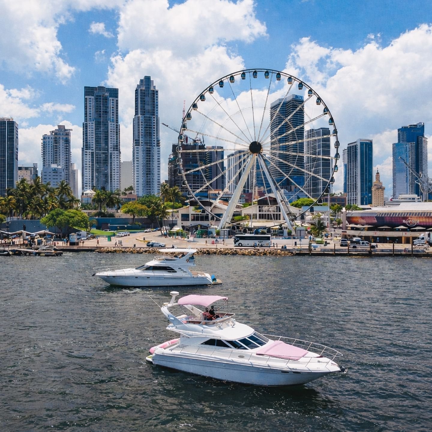Yachts at the Bayside marina with the Ferris wheel and Miami skyline