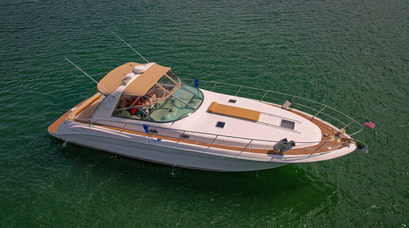 Aerial view of a sport yacht with tan canopy