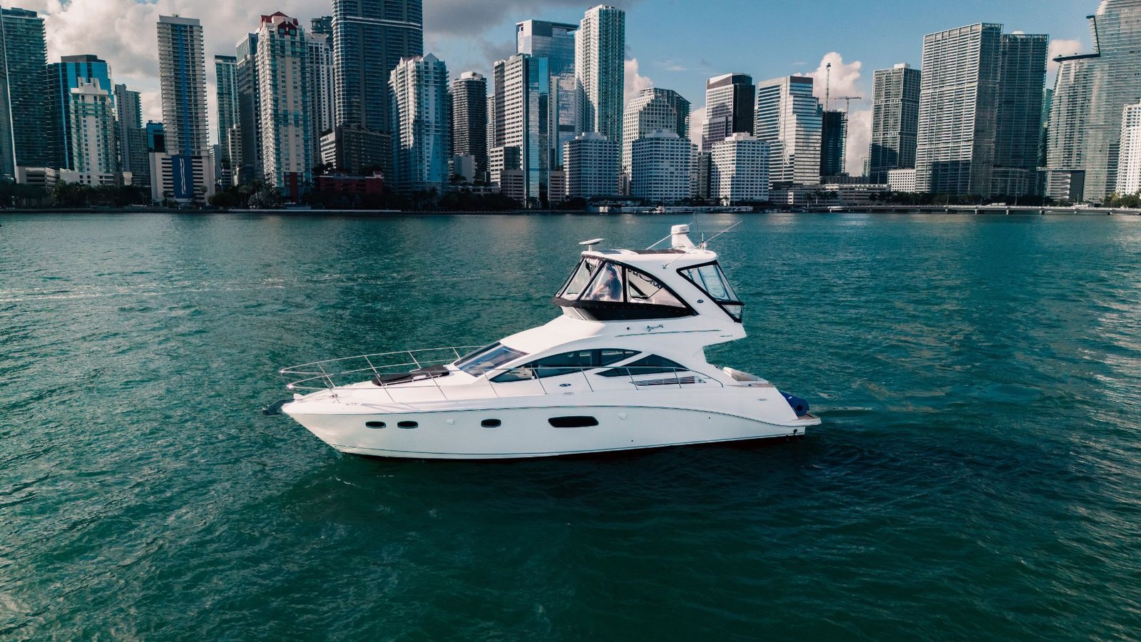 Sail La Vie 50' Sea Ray Express Bridge in front of the downtown Miami skyline