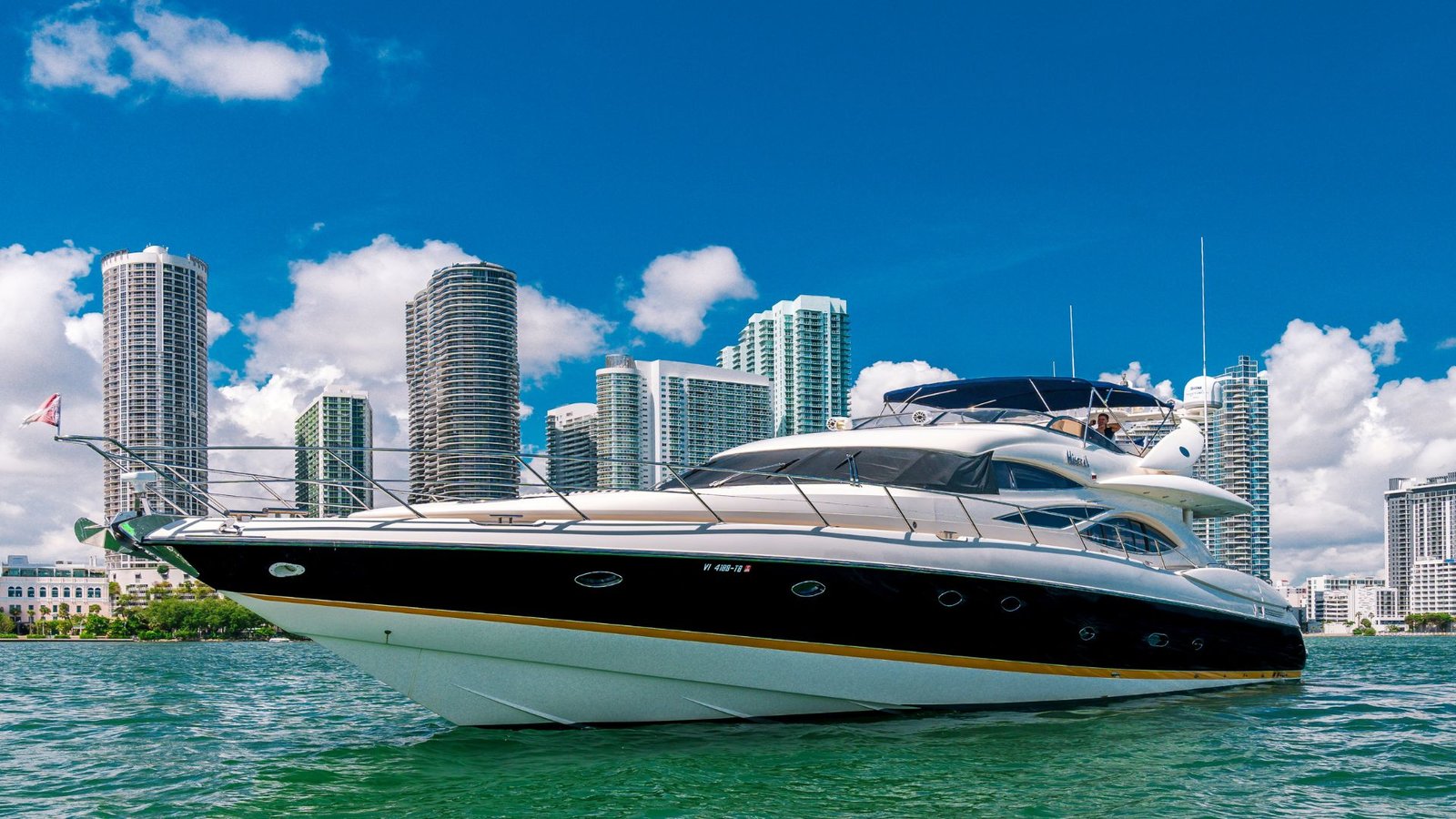 Sunseeker yacht anchored off the Miami skyline