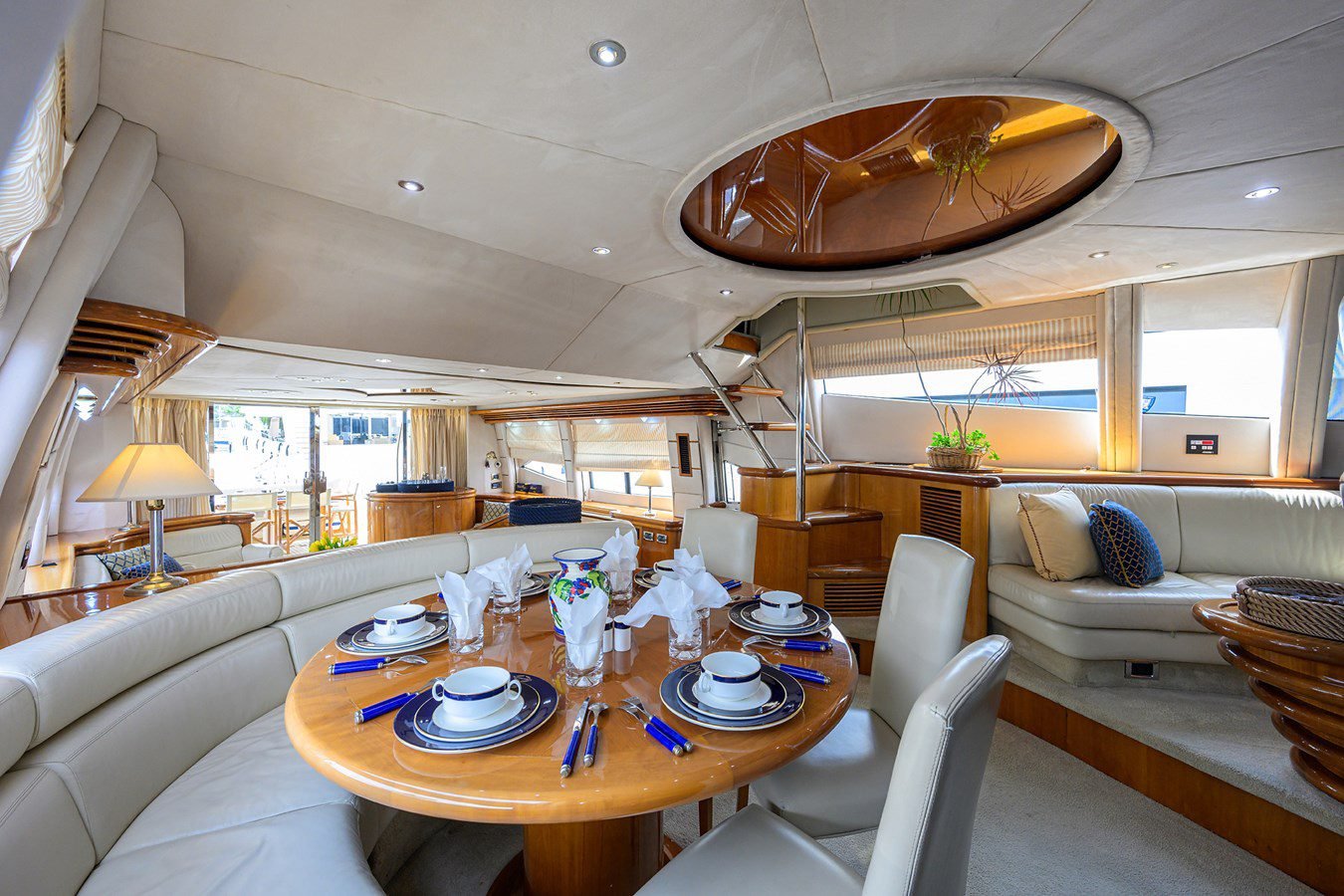 Yacht dining salon with a table set for guests